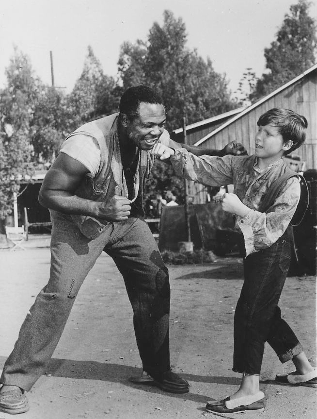Archie Moore and young actor Eddie Hodges in a 1960 film still