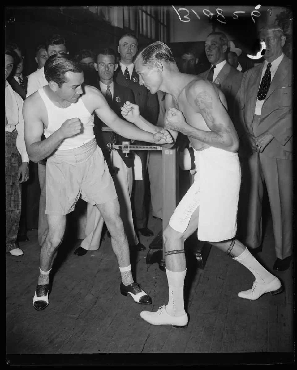 Boxers Barney Ross and Phil Furr posing together in 1936