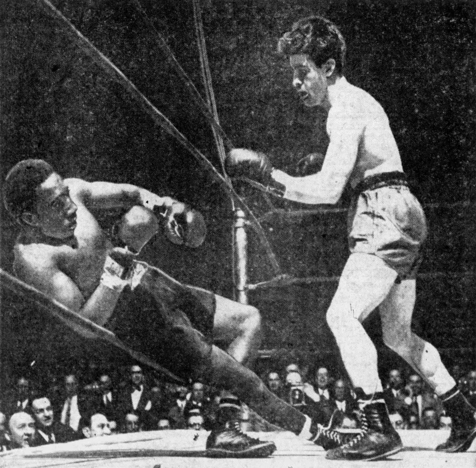 Boxer Billy Arnold falling through the ropes during his 1945 fight with Rocky Graziano
