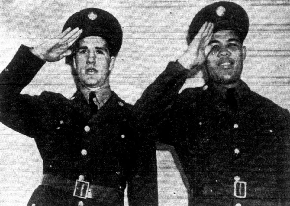 Billy Conn and Joe Louis standing side by side in 1942