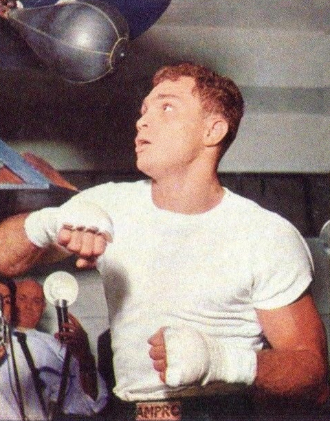 Trading card portrait of boxer Carlos Ortiz from 1966