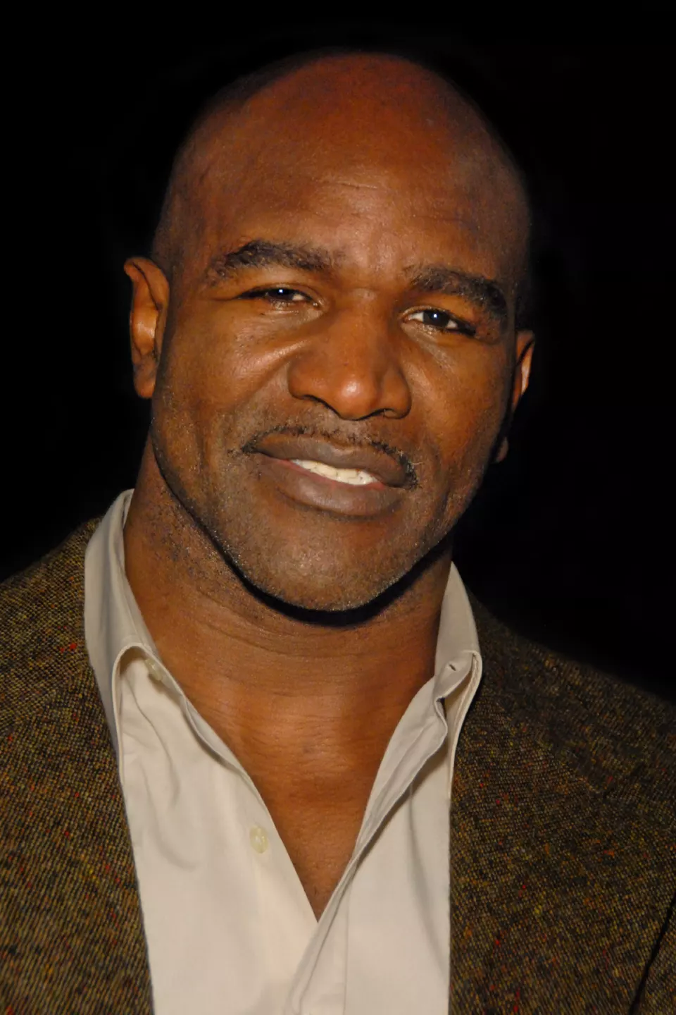Evander Holyfield smiling at an event in Los Angeles
