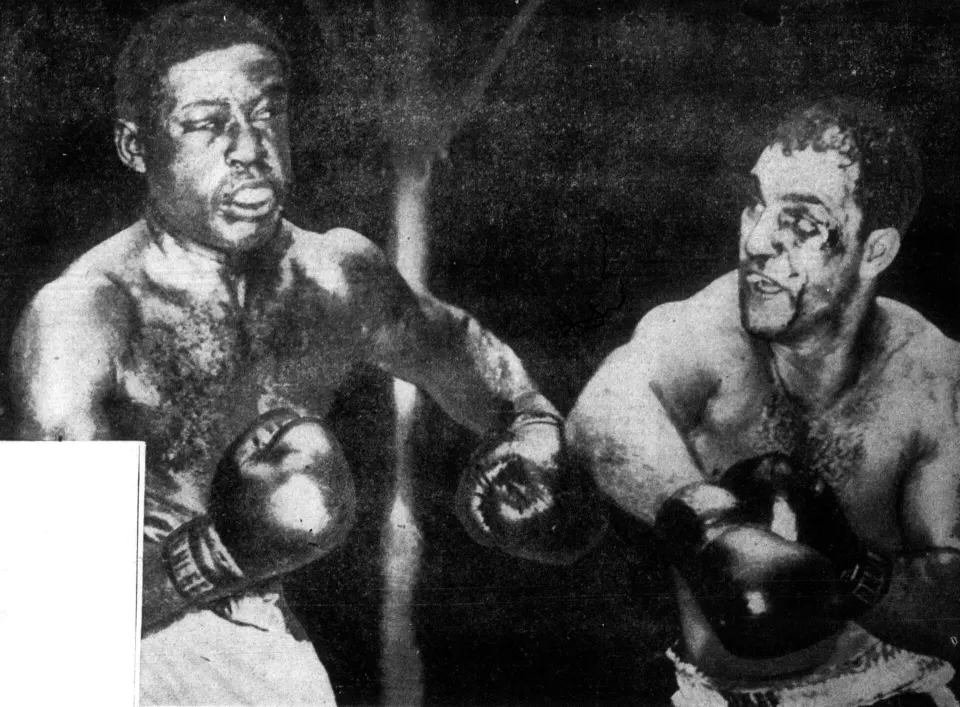 Ezzard Charles and Rocky Marciano exchanging punches in 1954