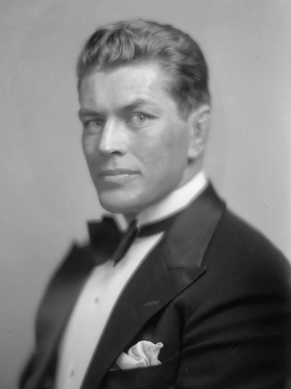 Black-and-white studio portrait of boxer Gene Tunney