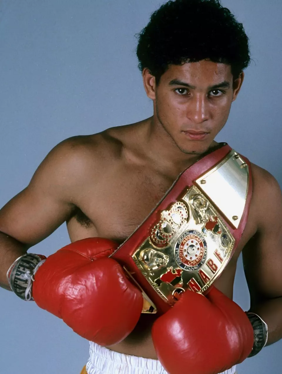 Young Héctor Camacho posing in boxing gear