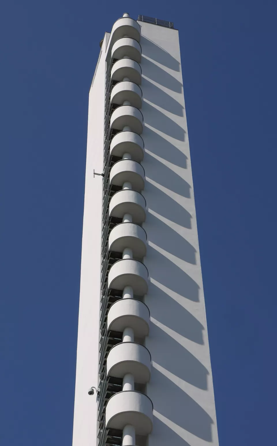 White tower of the Helsinki Olympic Stadium against the sky