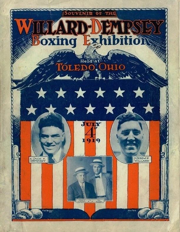 Two heavyweight boxers fighting in an outdoor ring in 1919