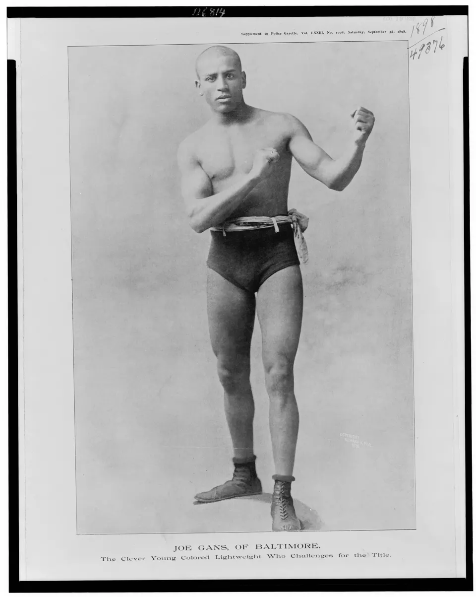 Studio portrait of young boxer Joe Gans in fighting pose