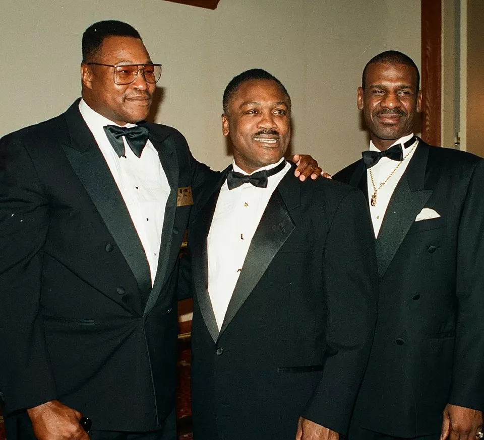 Larry Holmes, Joe Frazier and Michael Spinks posing together in 1996