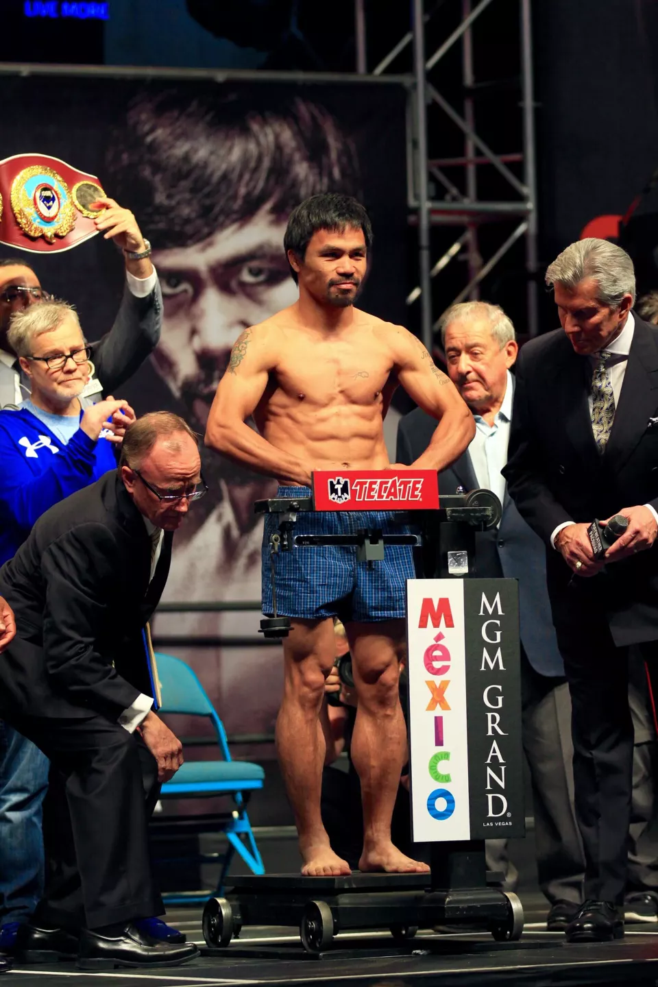 Manny Pacquiao on the scale at the weigh-in for the Mayweather fight