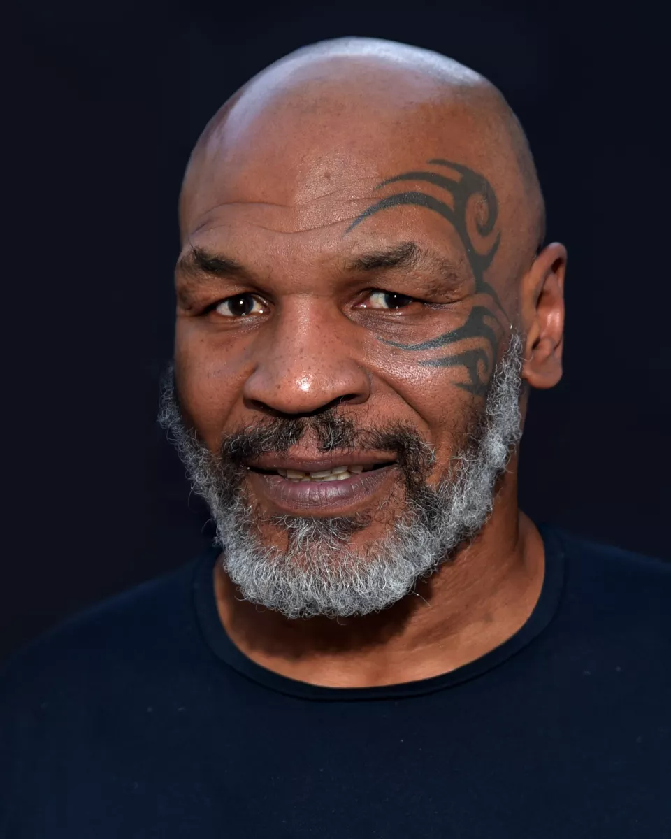Mike Tyson smiling at an event in 2019