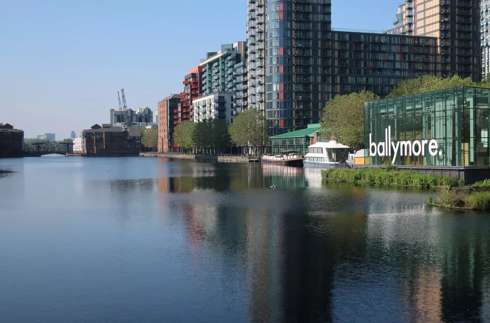 Water of Millwall Inner Dock lined by modern buildings on the Isle of Dogs