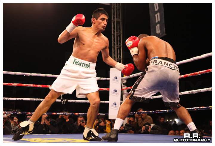 Erik Morales boxing Francisco Lorenzo in a ring in Tijuana