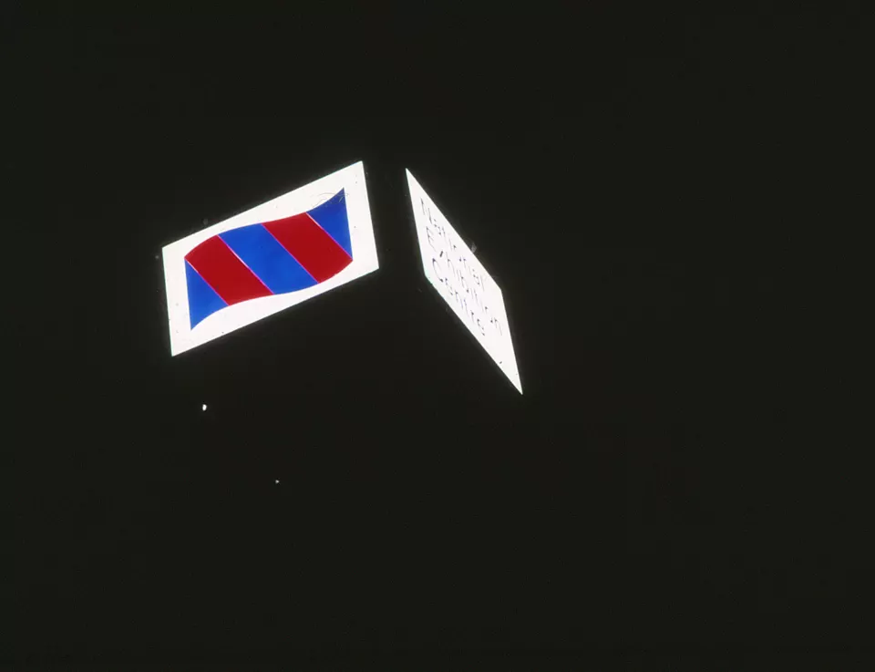 Illuminated National Exhibition Centre sign at night