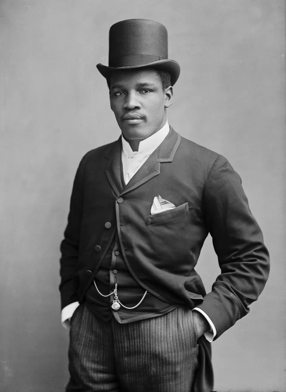 Studio portrait of boxer Peter Jackson in fighting pose