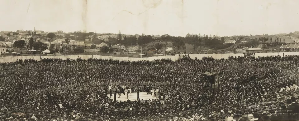 Panoramic photograph of a packed open-air stadium in Sydney during the 1908 Burns-Johnson fight