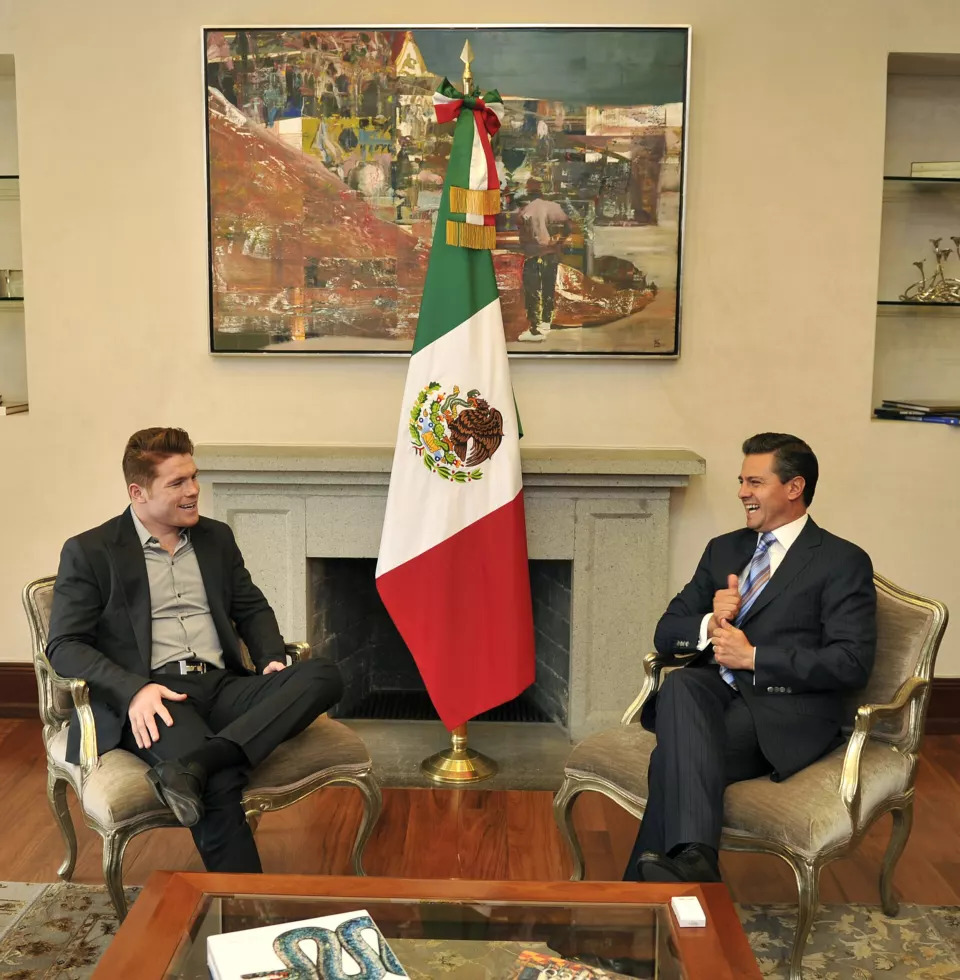 Canelo Alvarez in a suit during an official visit in 2013