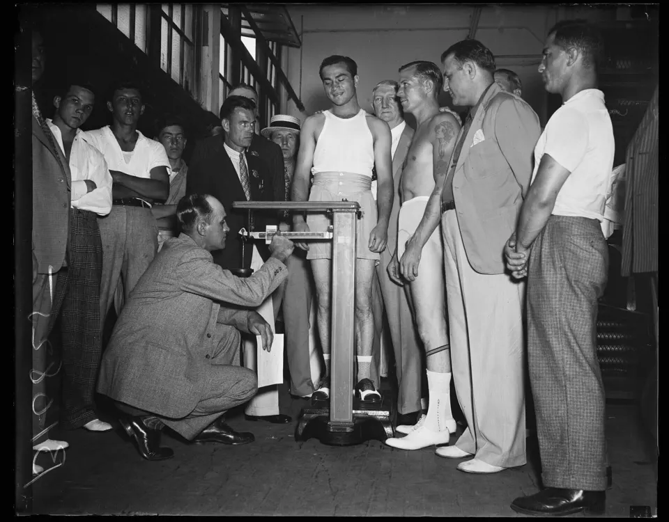 Barney Ross and Phil Furr at a weigh-in in 1936