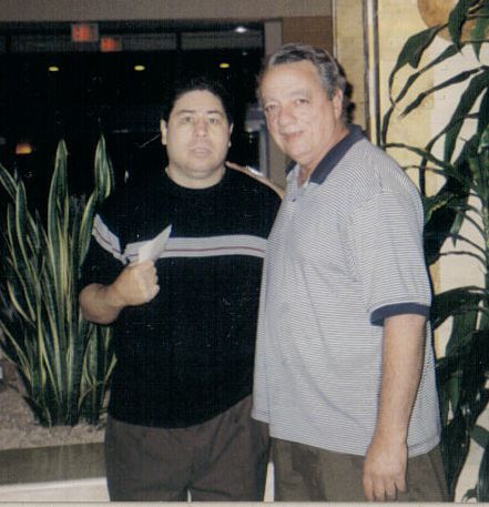 Former boxing champion Wilfredo Gómez posing with Tony Santiago