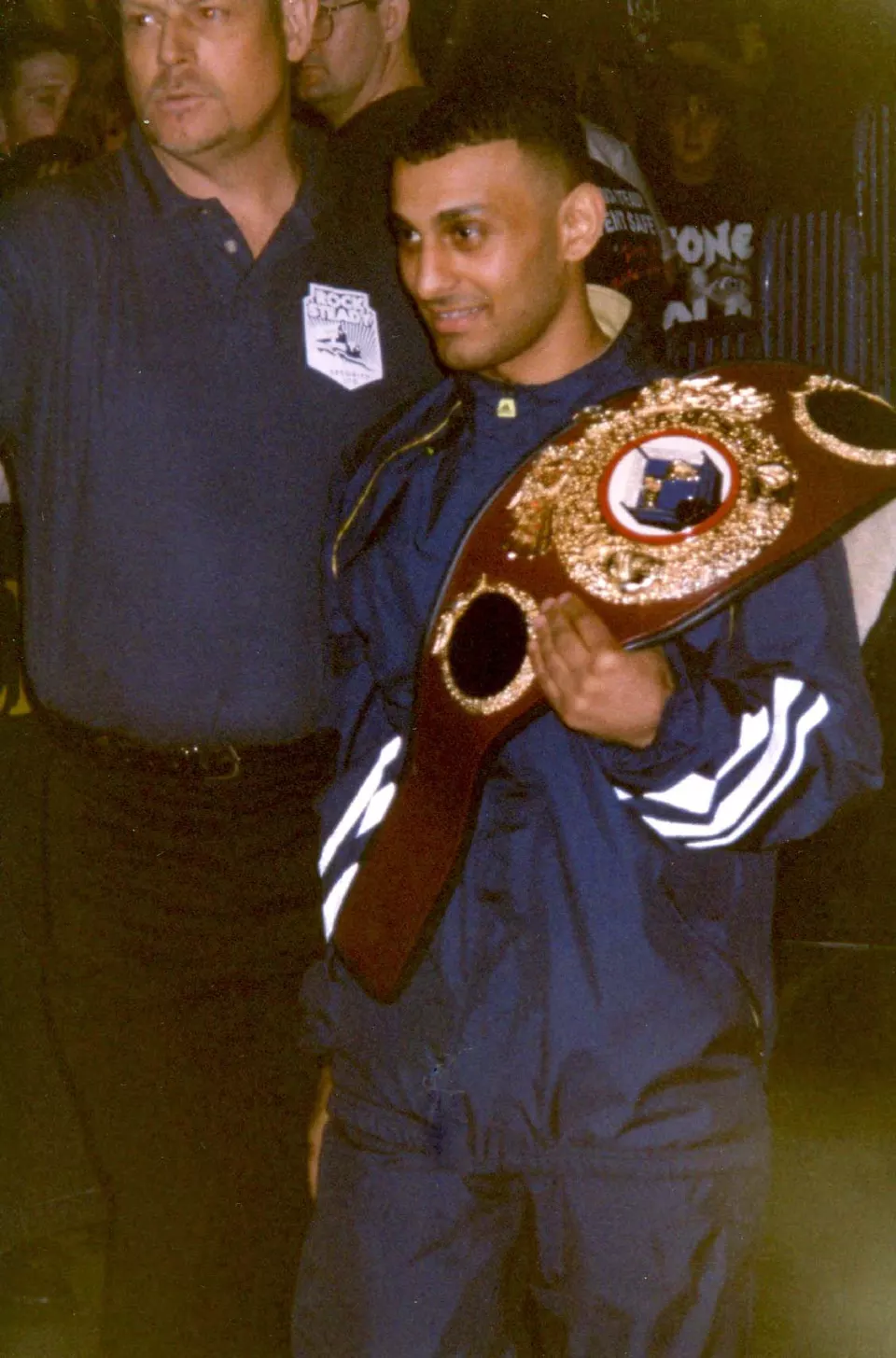 Naseem Hamed holding the WBO featherweight title belt